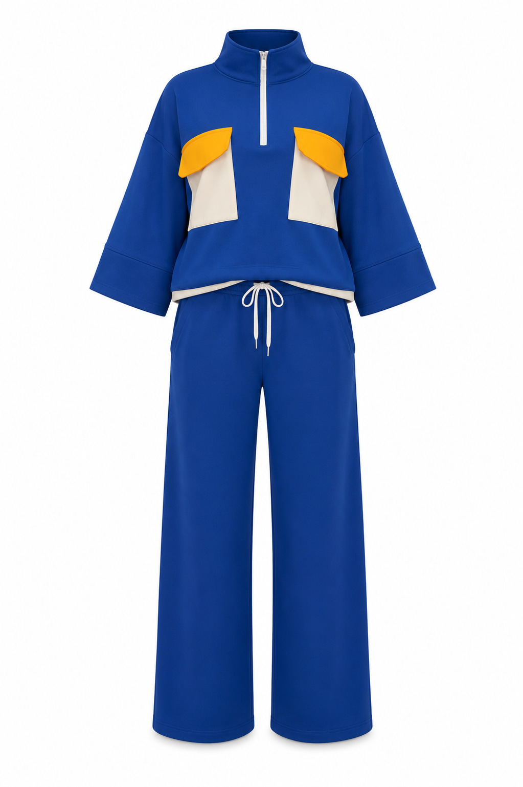 A two-piece blue tracksuit featuring a cropped half-zip top with yellow and white color-blocked panels on the chest, paired with matching wide-leg pants with a white drawstring waist.